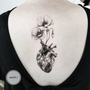 Tattoo by Zlata Kolomoyskaya #ZlataKolomoyskaya #GoldyZ #flowertattoos #illustrative #blackandgrey #fineline #dotwork #poppies #flower #floral #heart #anatomicalheart