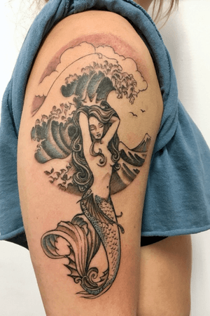 Mermaid and wave tattoo