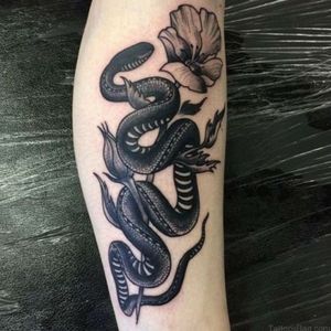 another snake with flowers. super planning my next tattoo right now and I'm loving #tattoodo so much right now. makes planning so much easier. all inspirational saved in one place! . . . . #inspiration #planning #nexttattoo #cantwait #snake #snaketattoo #flowers #flowertattoo #blackwork #blackworktattoo 