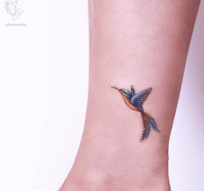 Premium AI Image | Watercolor Hummingbird Tattoo Design on a Flat Surface