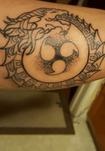 This tattoo here is inspired by Gojira a band from France. this is an ouroboros tattoo, to which represents the circle of life of a snake in eatting its  tail in this case a dragon ! incorporated with the curse mark seen in the anime Naruto.    Done by- instagram @dylansmith_ink