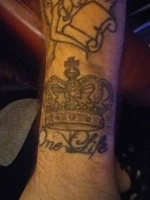 My first tattoo when i turnt 18 umm the Crown symbolizes  I control the way I want my life to be and I later got the one life added under it meaning you only live one life! 