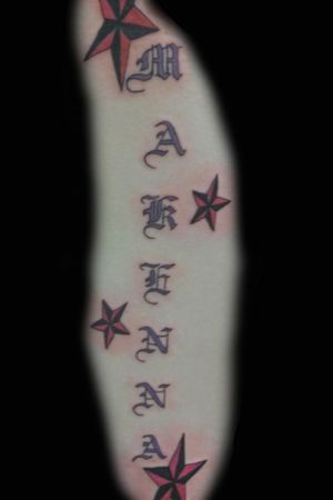 Old English lettering with nautical stars on rib cage