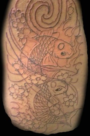 Start of the line work for Japanese koi on rib cage