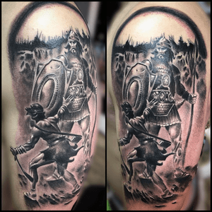David and goliath tattoo in black an grey