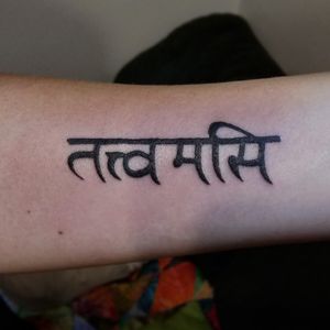 A Sanskrit mantra (Tat Tvam Asi) on the right forearm of the client. Poked with 3RL and 7RS needles.
