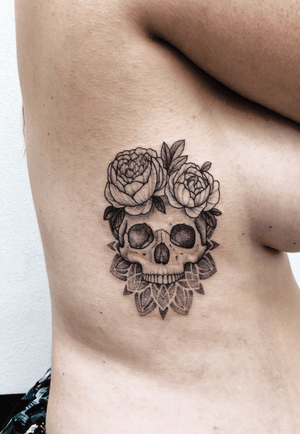 Dotwork skull with flowers and mandala on the ribs