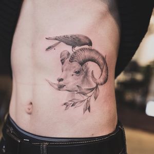 Tattoo by Nando #Nando #naturetattoo #blackandgrey #illustrative #realism #realistic #bird #fineline #feathers #wings #mouflon #ibex #goat #sheep #horns #leaves #plant #nature