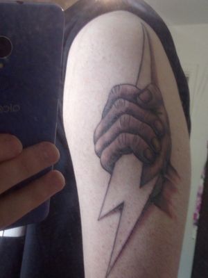 My first tattoo, photo quality is bad.Zeus holding a thunderbolt