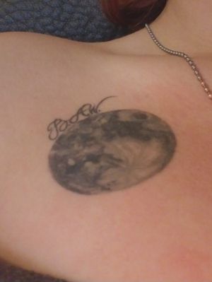 This is a moon tattoo I got a little over a year ago. About 2 years ago my nephew passed away before he could breathe his first breath. He didn't make it to see the light of day. I got this piece done as a tribute to him. Because "moon baby" was the first and only nickname that popped into my head when I heard my Sister was pregnant. This is on the right side of my chest about 5 centimeters under my collar bone. On my left side I want to add on my 2 other nieces (And one new mystery baby that's on the way) as points of a sun. Thank you Sean at Theoretical Ink in Colorado 