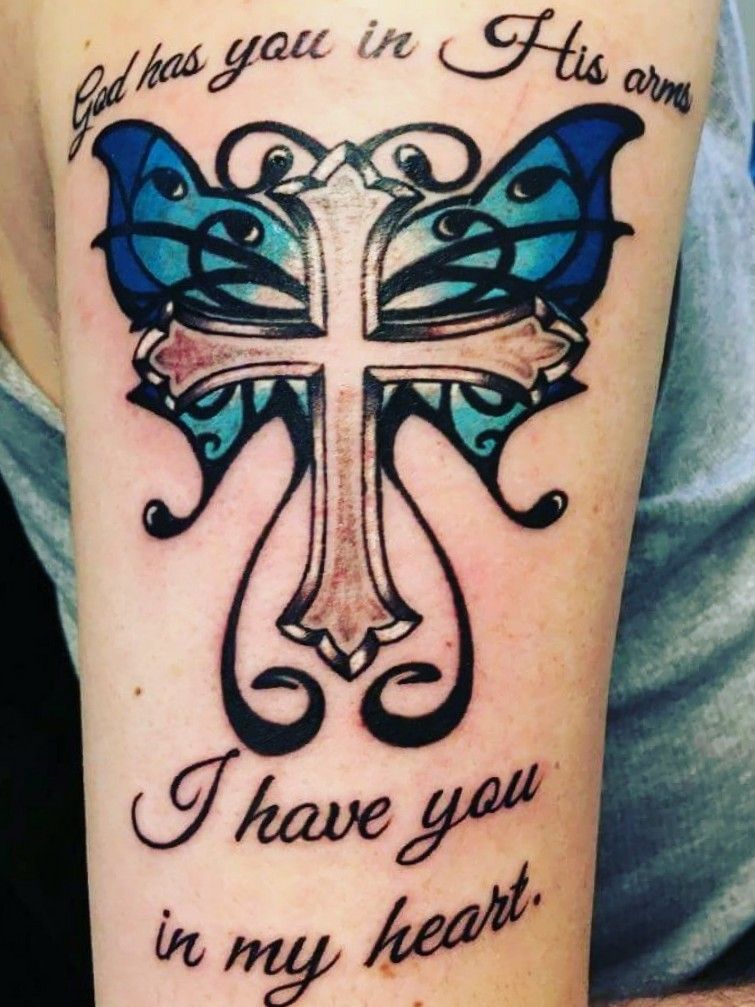 Tattoo uploaded by Alex Palleschi • Tattoo I got of a blue Monarch Butterfly  with a cross in the middle. It says 