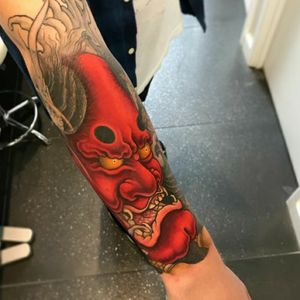 Red Hannya with golden eyes placed on the top of the forearm. Completed by Arran Burton at Fudoshin Tattoos. 
