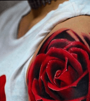 realistic red rose in color on arm by Marci at tattoo anansi Munich Germany/ Europe