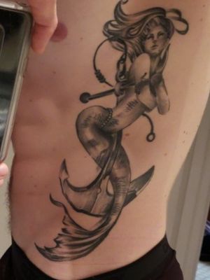 My mermaid and anchor tattoo in honor of my service as a diver in the navy. 