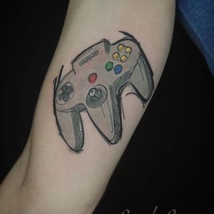 Get a unique joystick tattoo on your arm in London. Neo-traditional style with illustrative details.