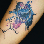 Experience the cosmic beauty with this stunning watercolor geometric galaxy tattoo by artist Alex Santo.