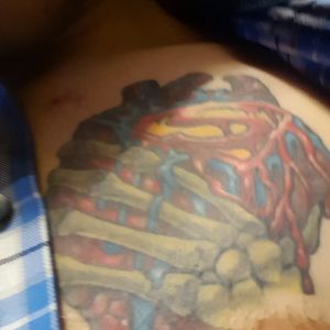 Superman heart With a skeletal kryptonite infected hand 