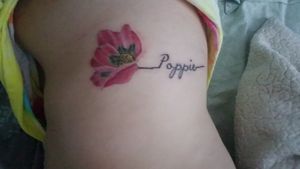 This says Poppie, which is what i called my grandfather. Him and i were very close & he passed away last year. This was my first tattoo!