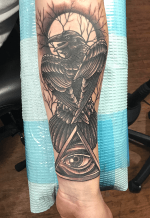 Sort of a neotraditional raven with tree branches and a full moon behind it, also an all seeing eye at the bottom. Artist: John Kautz. Studio: The Silver Key Tattoo. #tree #branches #fullmoon #moon #raven #bird #neotraditional #blackandgrey #allseeingeye #illuminati #eye #triangle 