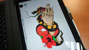 Snake, hand and hibiscus flower 