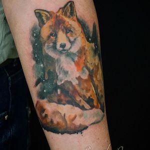 Express your wild spirit with this stunning watercolor fox tattoo on your forearm, created by artist Alex Santo.