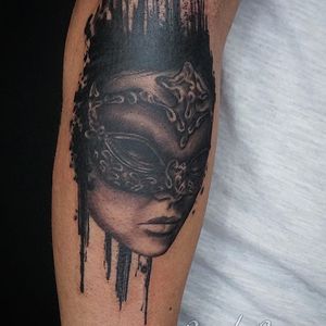 Capture the enigmatic beauty of a masked woman with this stunning blackwork tattoo by Alex Santo.