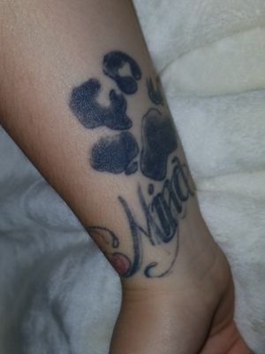 This one was done in Dawson Creek in 2013, Mina was the name of my dog I used to have. The letters are faded because of scarring. It turned out I was allergic to the white ink he used and it caused a severe reaction/rash over the name. 