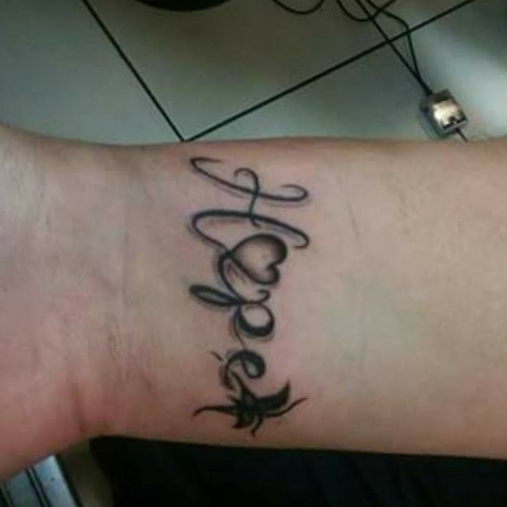 Hope lettering tattoo on the wrist