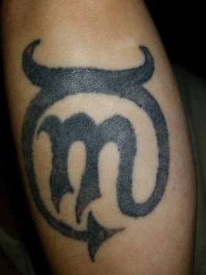 I mixed my sign (scorpio) and my wife's sign (taurus) into one tattoo symbolizing us uniting as one. #scorpio #Taurus #astrology #black