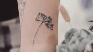 Handpoked tattoo flower