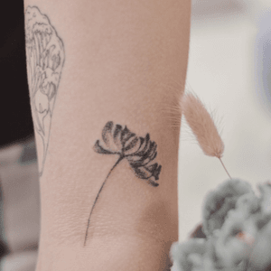 Handpoked flower tattoo