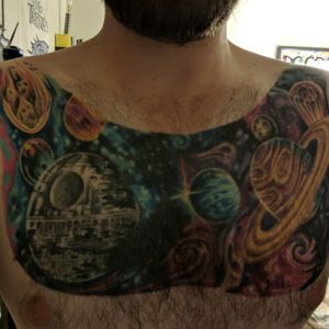 Starwars Deathstar + Galaxy far far away Chest Piece done about 5 years ago, still looking bright, and was also a cover up for a tattoo I did not think threw when 18 haha.