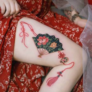 Korean traditional fan with red string inspired by norigae. *Norigae= Korean traditional ornaments by SION (@tattooistsion) #flowertattoo #floraltattoo #Korea #KoreanArtist #tattooistsion #colortattoo #flower #flowers #oriental #watercolortattoo #fan