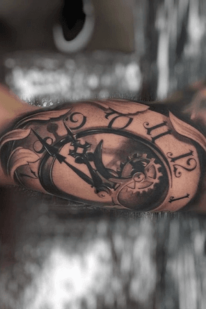clock tattoo on inner bicep