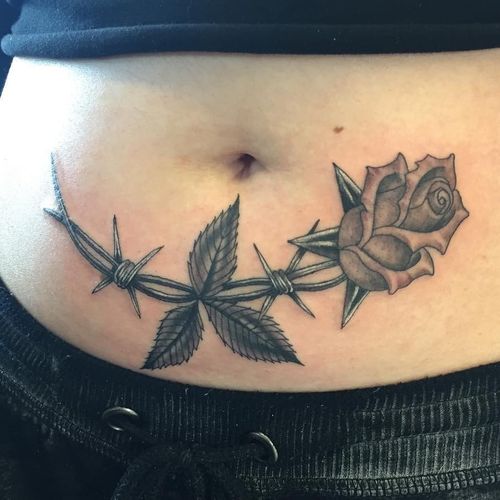 Tattoo by Tamara Santibanez #TamaraSantibanez #barbedwire #blackandgrey #linework #metal #wire #rose #flower #floral #leaves #nature