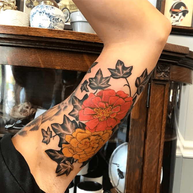 Share more than 65 traditional marigold tattoo latest  incdgdbentre