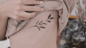 Rib tattoo - linework - blackwork - leaves