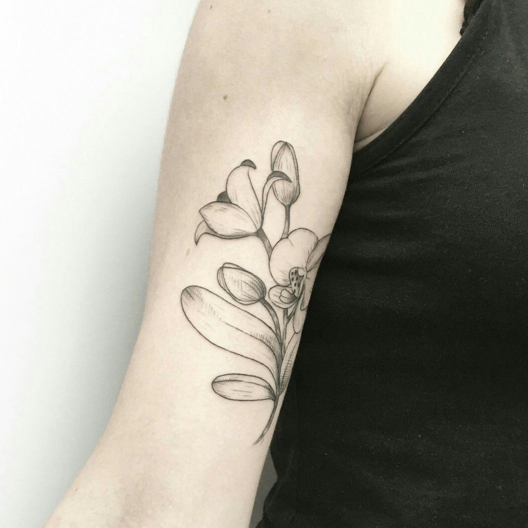 Line art flowers tattoo on the inner arm healed