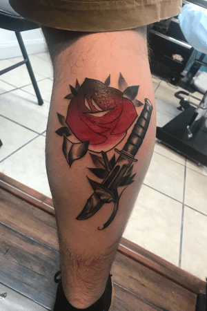 Rose and knife tattoo