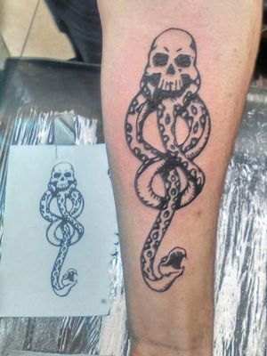 Watch out for this one... Not saying he's a death eater but he sports the dark mark proudly. #HarryPotterTattoos #TattooedByJesse #dynamicblack #skull #snake #blackwork #voldemort #forearm 