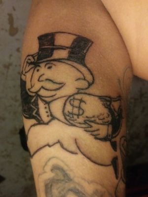 Monopoly man (Self given tattoo)