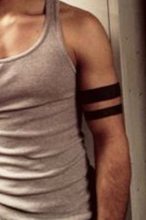 two black bands around his left bicep that will eventually become the symbol of the McCall pack. It is also reference to a quote Scott said about the samoan word for "tattoo meaning" an open wound."