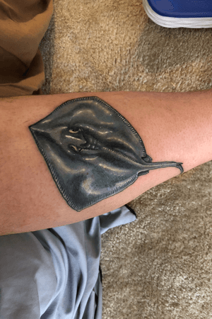 Deep blue ans purple stingray done by sloo at made to last tattoo. 