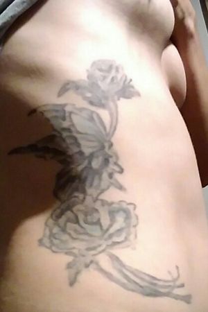 My right side rib cage butterfly and rose