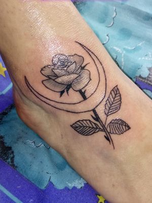 Tattoo rose on foot 