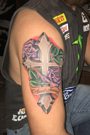 This is for my aunt Jenny that had passed away. Roses were her favorite flower and she loved the color purple. I wanted the red outlining behind the tattoo to make it stand out and for people to notice it. 