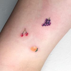 Tattoo by Mocha Poke #MochaPoke #cherrytattoos #cherrytattoo #cherry #fruit #fruittattoo #foodtattoo #food #cute #tiny #small #minimal #watercolor #lemon #grapes #painterly