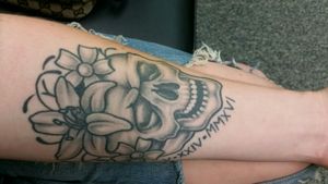 Got this done April 2017 at Hard Knox Tattoo parlor in Knoxville, TN. Happy skull with Lily & flowers + an important date to me I'm roman numerals. 