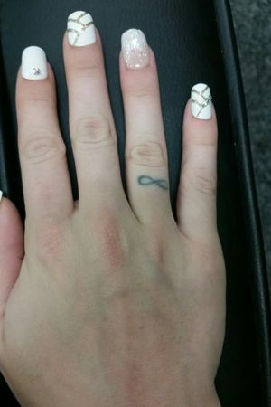 My first tattoo, got it back in 2008. Infinity symbol on my ring finger. 