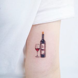 Tattoo by Heemee #Heemee #Seoultattoos #Seoul #KoreanArtist #color #realism #realistic #hyperrealism #glass #bottle #wine #cherry #cherrywine #alcohol #drink #wineglass #wino